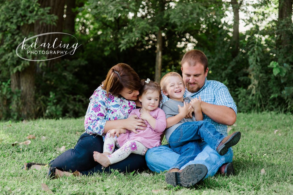 family of four poses for 2 year old birthday