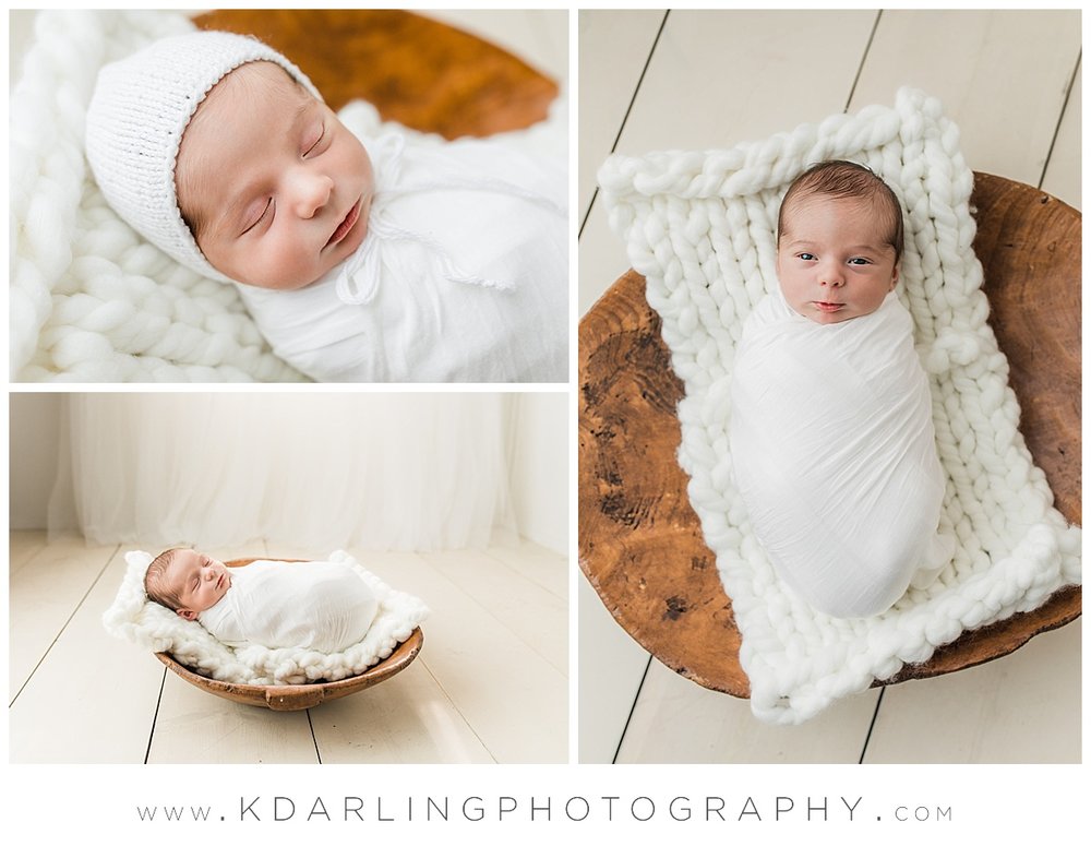 Newborn baby boy in a white bonnet