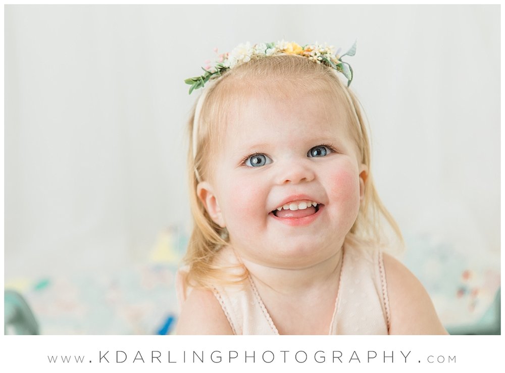 Two year old girl wearing floral crown