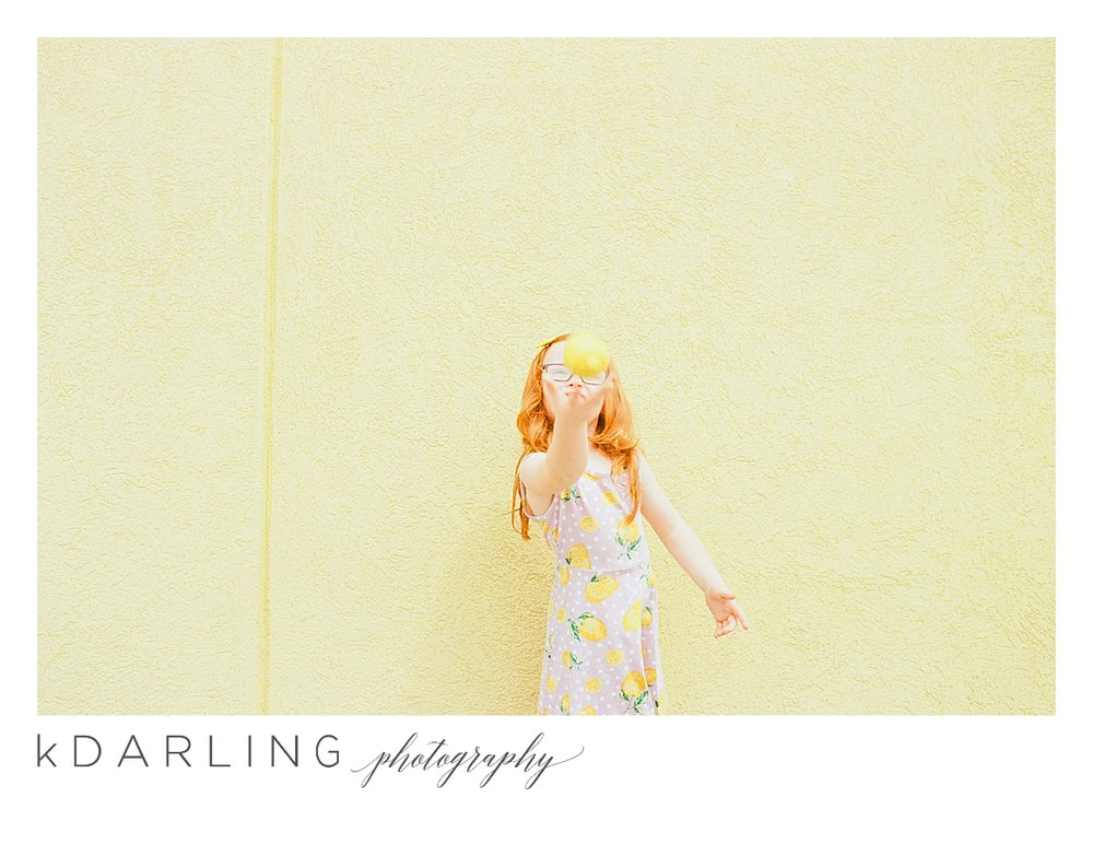 Photo-session-with-yellow-lemons-and-kindergarten-age-girl-downtown-champaign-Il-film-photographer_0014.jpg