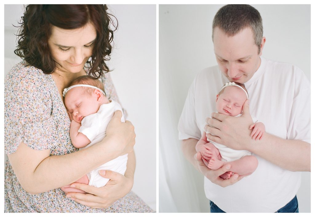 Newborn baby photo shoot with parents in white studio