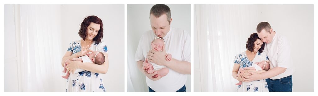 newborn baby posed with parents