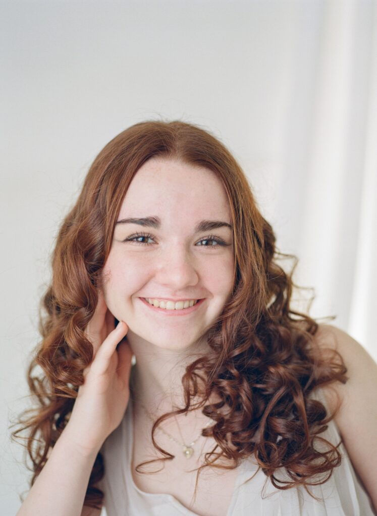 High school senior girls during milestone mini sessions in a neutral studio in Fisher IL